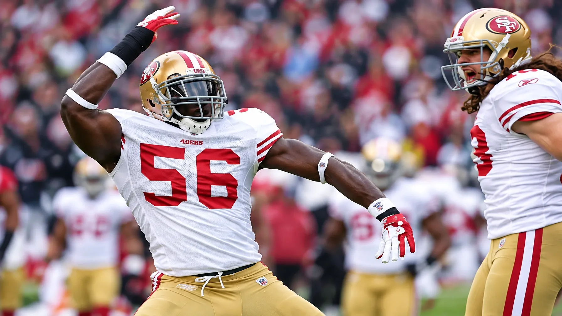 San Francisco 49ers number 56 celebrating between teammates on the field